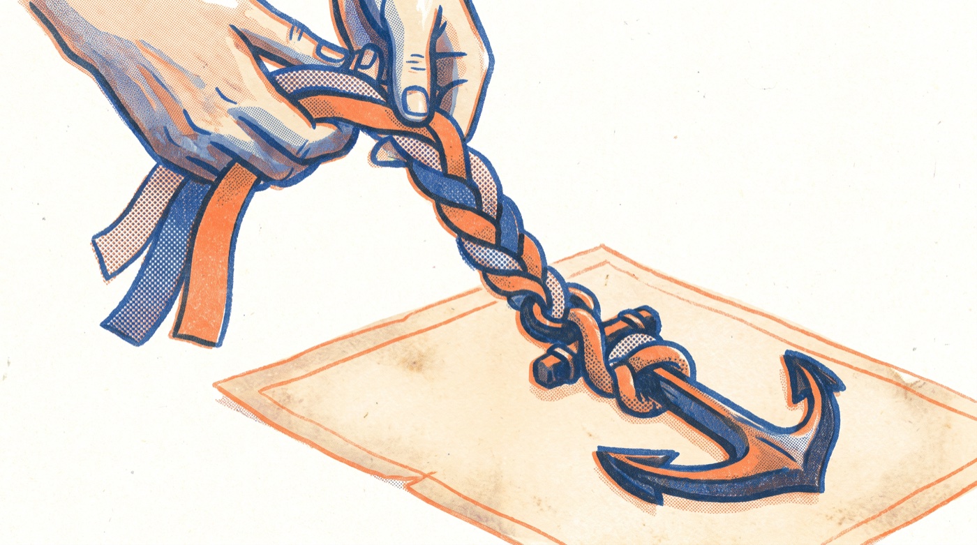 A pair of hands braids three ribbons, two orange and one blue, into a single cord that is knotted around a heavy anchor resting on a sheet of parchment.